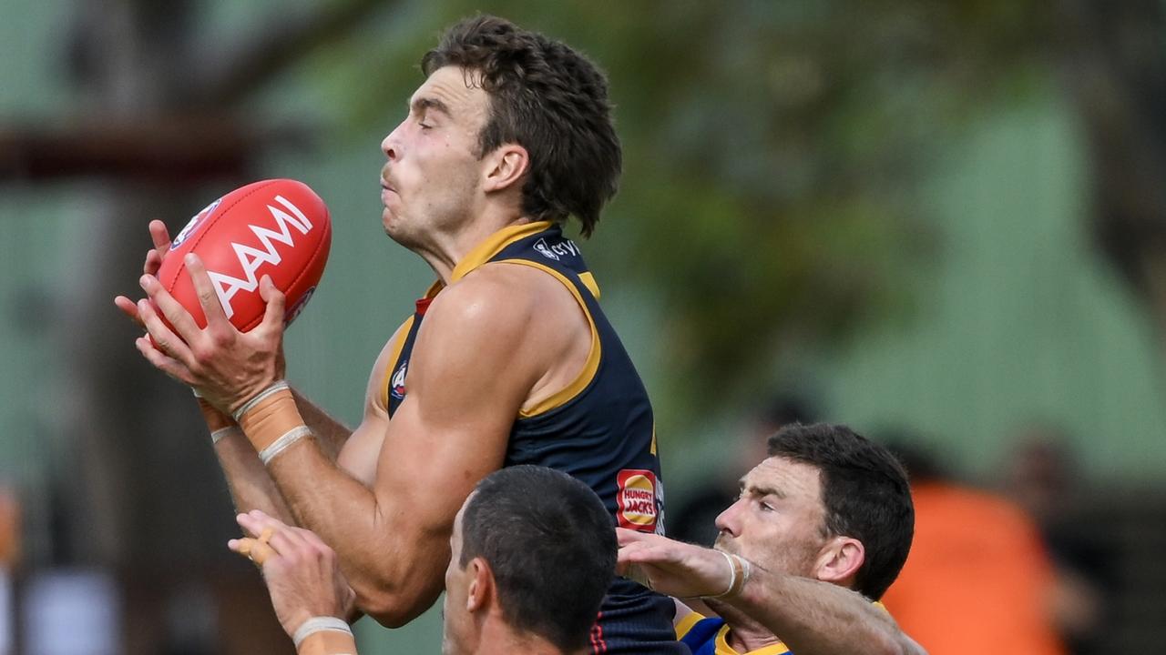 Riley Thilthorpe marks in front of Jeremy McGovern at Hisense Stadium in the Crows and Eagles’ pre-season game. Picture:Mark Brake/Getty Images.