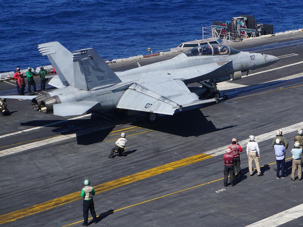 (FILES) In this file photo taken on February 14, 2018 an F-18 Hornet fighter jet prepares to take off from the flight deck of the aircraft carrier USS Carl Vinson on as the carrier strike group takes part in a routine deployment mission in the South China Sea. Canada said on February 22, 2018, it was allowing Boeing to submit a bid to replace the country's aging F-18 fleet, after an earlier trade dispute between the American manufacturer and Ottawa. / AFP PHOTO / AYEE MACARAIG