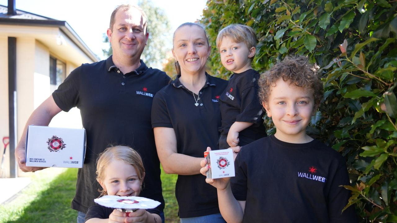 Celebrating the success of their startup WallWeb are Toowoomba's Arron and Marina French, with children Vincent, Nicholas and Alexander.