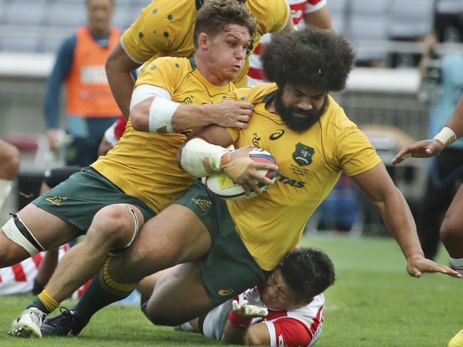 Tatafu Polota-Nau barges over to score a try against Japan during their friendly Rugby match in Yokohama in November.