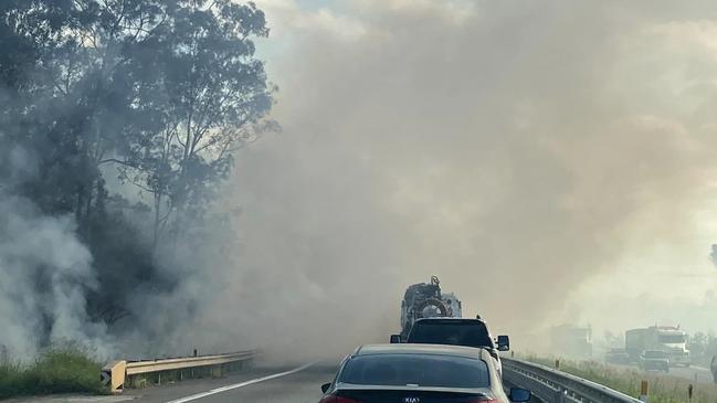 Smoke warning issued for areas around Blackwater near Ipswich as fire can be seen next to the Cunningham Highway. Photo: Ipswich Metal Recycling