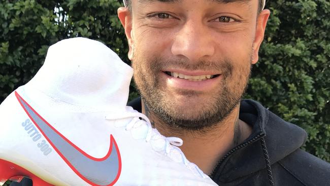 South Sydney Rabbitohs' John Sutton with his special 300-game boots.