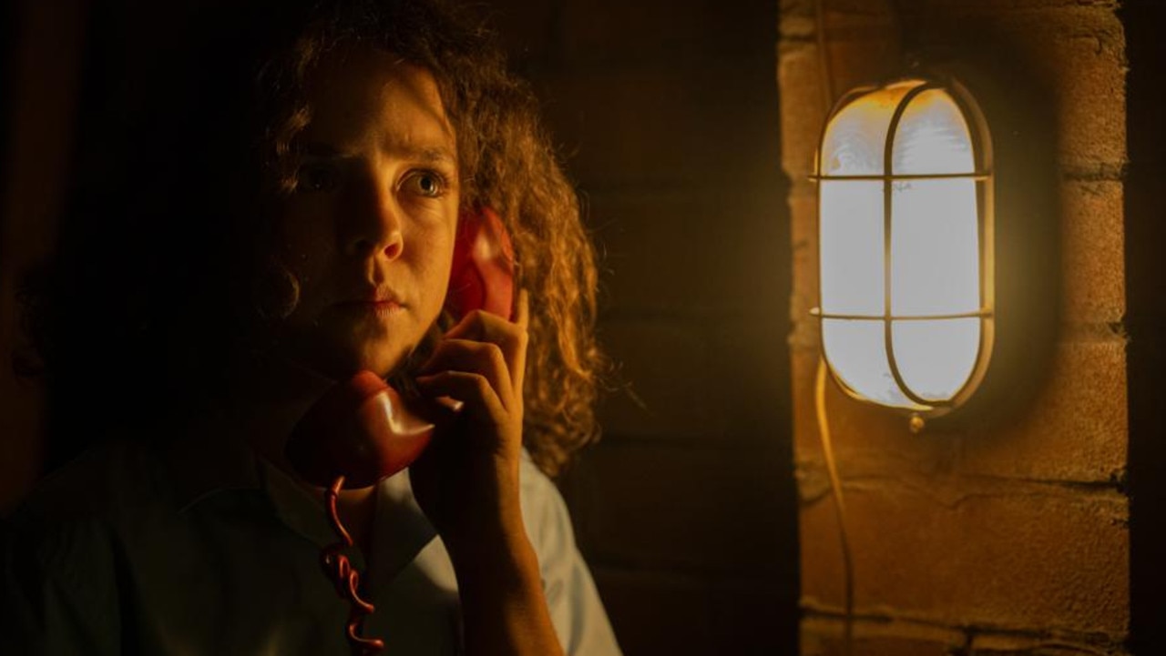 Felix Cameron plays protagonist Eli Bell in the Netflix adaptation of Queensland author Trent Dalton’s award-winning novel Boy Swallows Universe, who said at the Logies that the red telephone in the secret room was a real mystery from his own childhood. Picture: Netflix/supplied