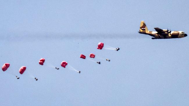 Egyptian Air Force C-130 Hercules turboprop aircraft dropping humanitarian aid above the besieged Palestinian territory. Picture: AFP