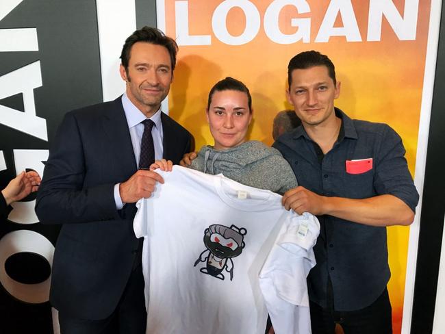 Clayton Spencer (far right) scores a photo with his idol Hugh Jackman at the premiere of Logan.