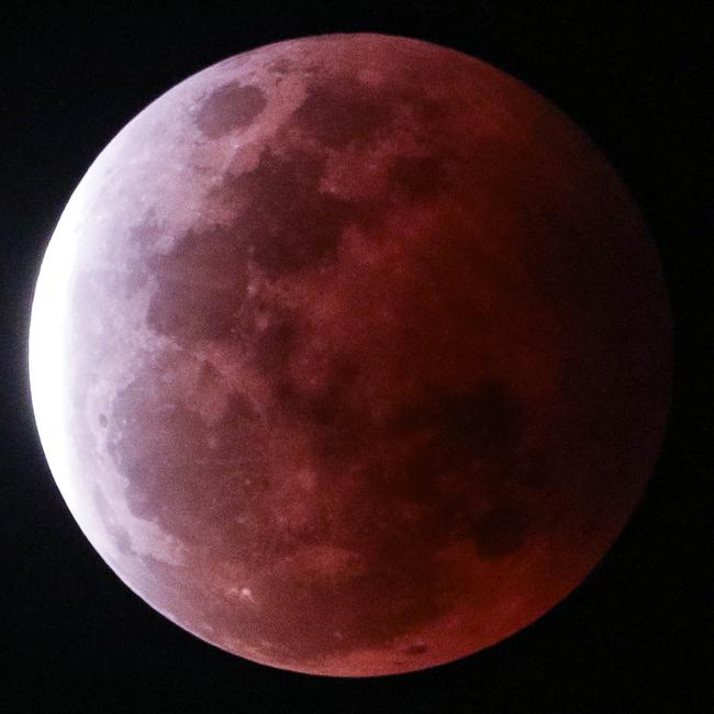 The super blood full moon seen over Darwin on Wednesday night. Pictures: Glenn Campbell