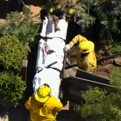 Heche is stretchered away after the accident. Picture: Fox 11