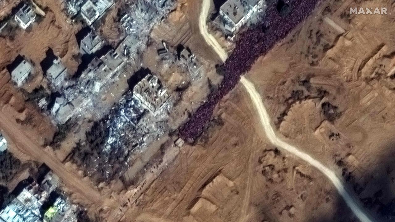 This satellite picture released shows a crowd of people fleeing toward the southern part of the Gaza Strip, gathered along the Salah Al-Din road. Picture: AFP