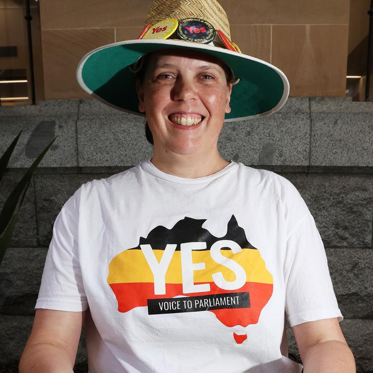 Helen Matthews handing out how to vote yes cards outside Brisbane City Hall. Picture: Liam Kidston