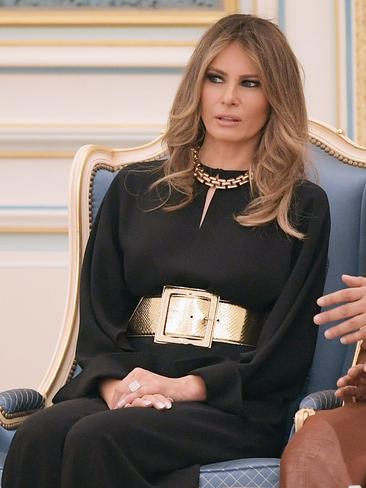 MAY 20: The First Lady teamed splashes of gold with a black Stella McCartney jumpsuit to make a striking arrival in Saudi Arabia. Picture: AFP