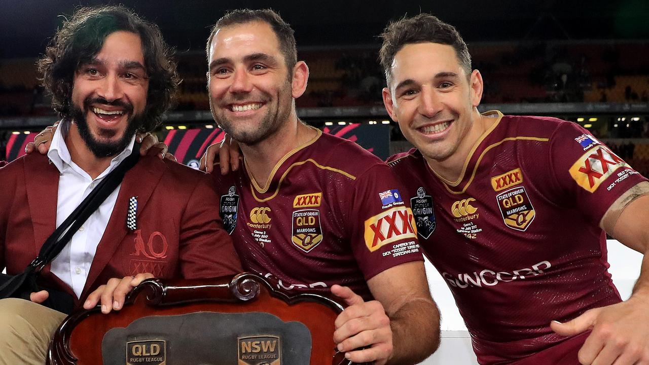 Cooper Cronk, Johnathan Thurston, Cameron Smith and Billy Slater hold the shield up to celebrate winning the Origin decider between Queensland and NSW at Suncorp Stadium in Brisbane. Pics Adam Head