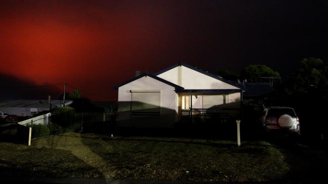 A red and smoke-filled sky is seen above the town of Kingscote. Picture: Getty Images