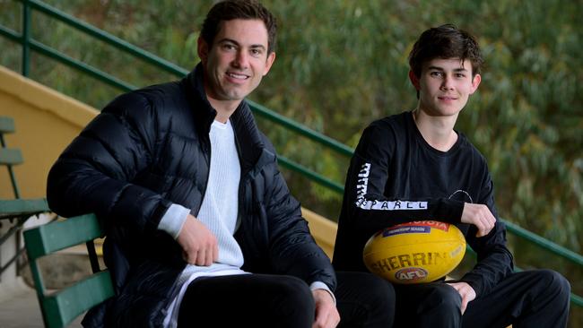 Daniel Menzel with school boy footballer Olly Piro, the duo has bonded over ACL injuries. Picture: Photo Sam Wundke.