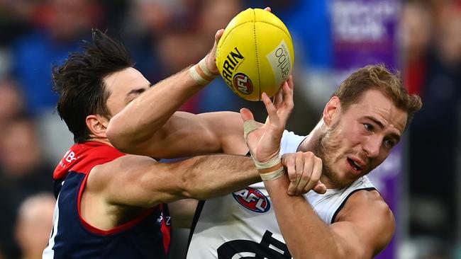 Harry McKay, who has been playing hurt, marks in front of Michael Hibberd. Picture: Getty Images