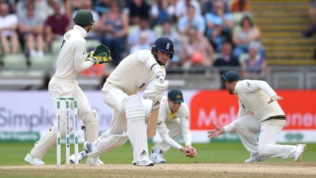 Steve Smith swoops to his left to take a low catch offered by Stuart Broad off the bowling of Nathan Lyon at Edgbaston. Picture: Getty Images