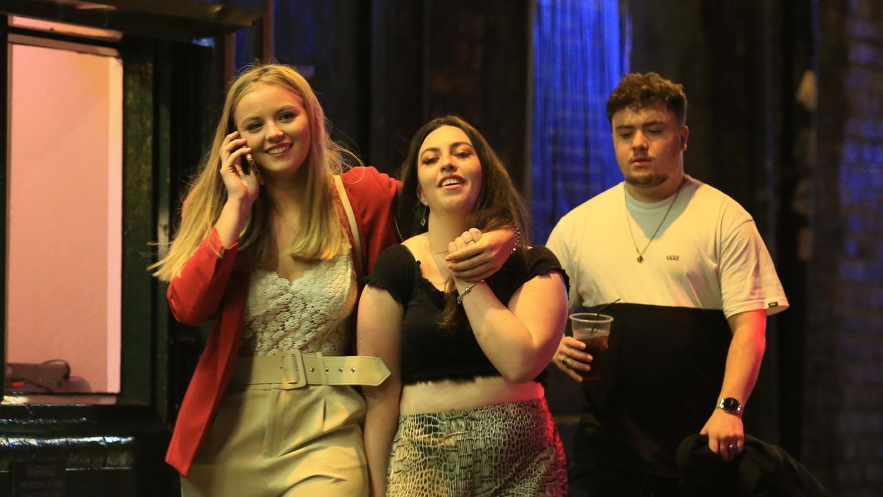 Revellers enjoy their night out in the centre of Liverpool, north west England which is set to face harsh new restrictions. Picture: Lindsey Parnaby / AFP