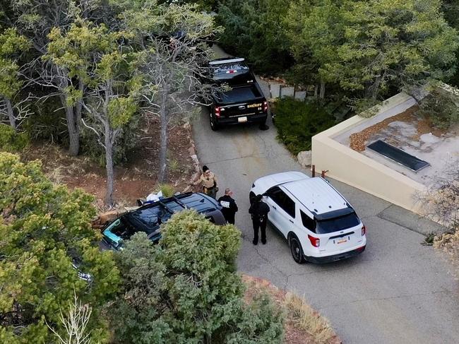 Law enforcement officials outside the home of Gene Hackman and Betsy Arakawa. Picture: AP