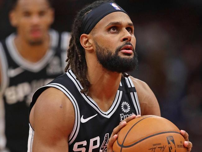 (FILES) In this file photo taken on January 27, 2020, Patty Mills of the San Antonio Spurs shoots a free throw against the Chicago Bulls at the United Center in Chicago, Illinois. The Bulls defeated the Spurs 110-109. NOTE TO USER: User expressly acknowledges and agrees that, by downloading and or using this photograph, User is consenting to the terms and conditions of the Getty Images License Agreement.   Jonathan Daniel/Getty Images/AFP - Mills said on July 28, 2020, he will donate his salary from eight upcoming NBA games -- more than $1 million -- to social justice organizations in his homeland. The 31-year-old Australian standout, who helped the Spurs capture the 2014 NBA crown, said in a social media video his salary for the club's eight scheduled games in the COVID-19 protected Orlando bubble will go to Black Lives Matter groups. (Photo by JONATHAN DANIEL / GETTY IMAGES NORTH AMERICA / AFP)