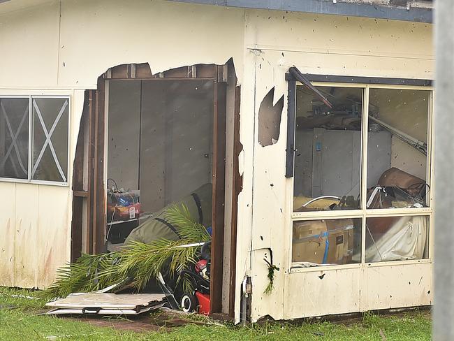 A house in Airlie is left with a gapping hole and a tree on the roof during Cyclone Debbie. Picture: Alix Sweeney