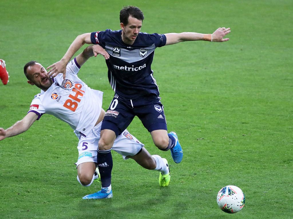 Robbie Kruse holds off 2015 Asian Cup winning teammate Ivan Franjic in Victory’s 1-0 win over Perth Glory. Picture: AAP Image