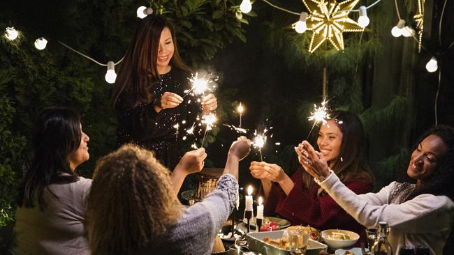 Latino women have dinner party at house yard