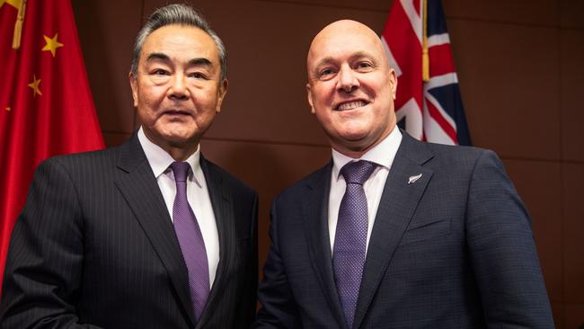 Chinese Foreign Minister Wang Yi shakes hands with New Zealand Prime Minister Christopher Luxon. Picture: Getty Images.