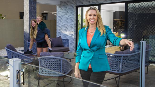 Karen Pirie of Harcourts Coastal, with her kids, Sienna, 13 and Cole, 11. Picture: Nigel Hallett.