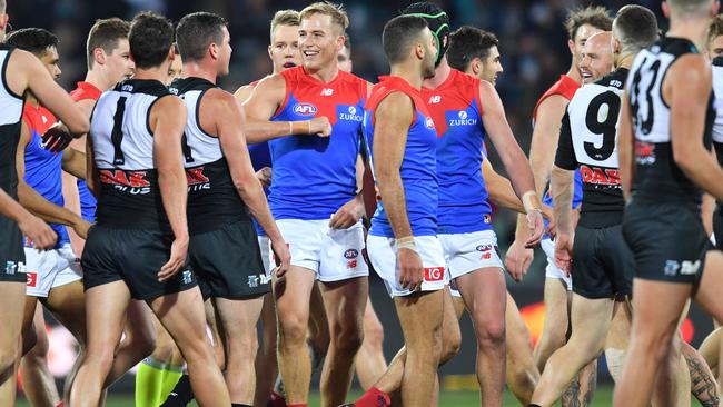 Bernie Vince remonstrates with Port’s Tom Rockliff as tensions boil over at half-time.