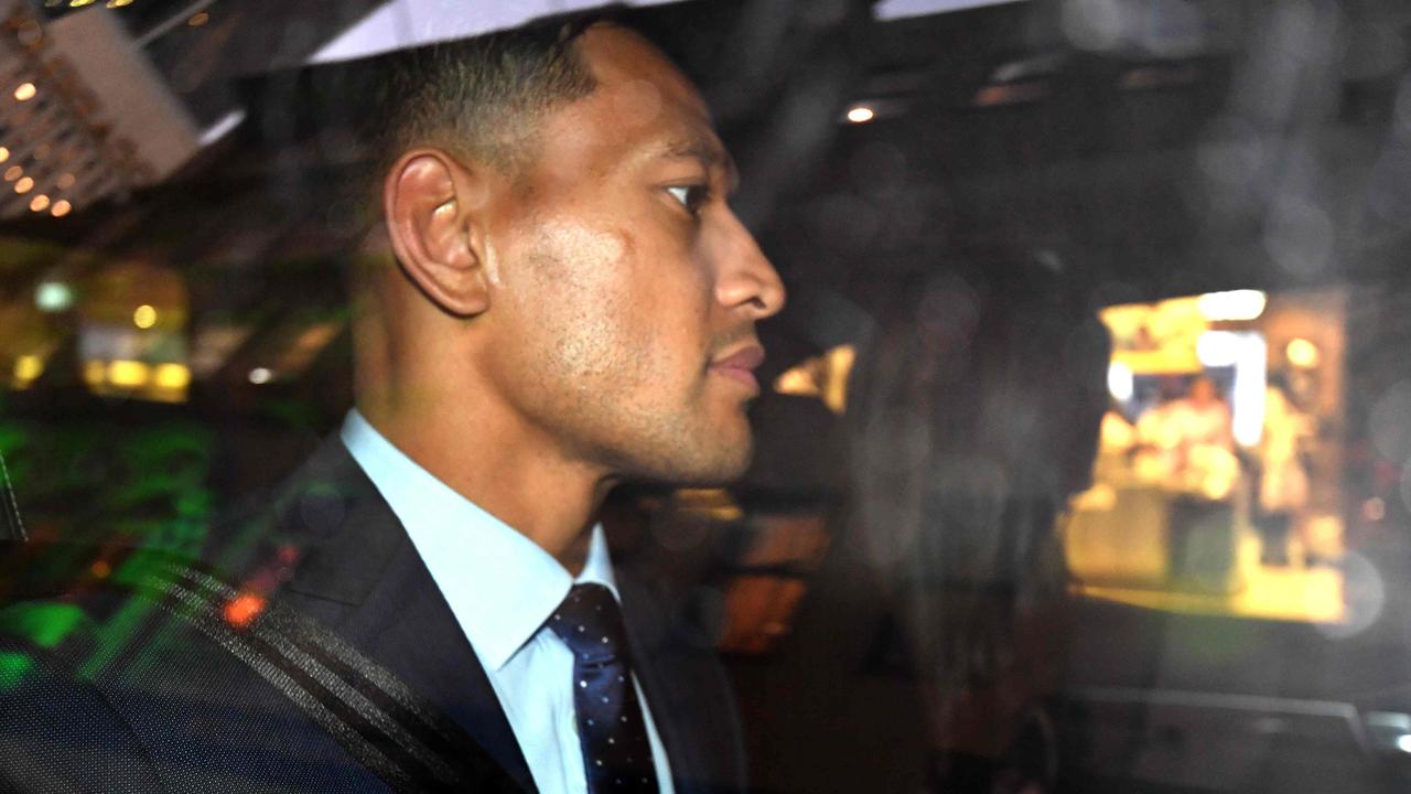 Israel Folau leaves after the code of conduct hearing in Sydney.