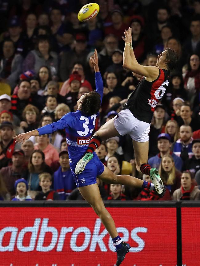 Essendon's Joe Daniher takes a big mark over Western Bulldogs Lewis Young . Pic: Michael Klein