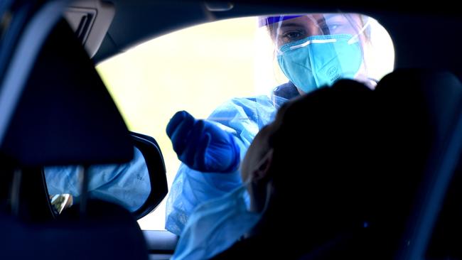 A medical worker carries out a drive-through COVID-19 test in Winnetka, California. Picture: Getty Images