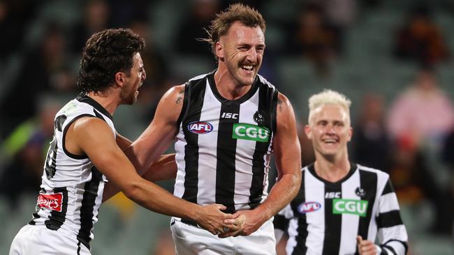 Lynden Dunn celebrates a goal with teammate Josh Daicos during the Round 11 match against Adelaide. Picture: Matt Turner/Getty Images