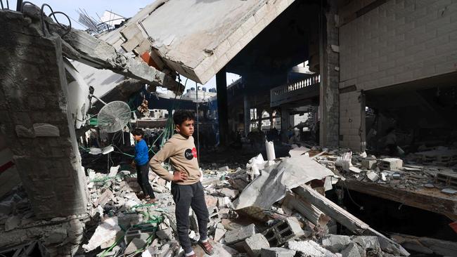 People inspect the damage in the rubble of a mosque following Israeli bombardment, in Rafah, on the southern Gaza Strip. Picture: Mohammed Abed/AFP