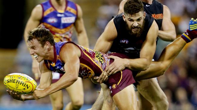 AFL Brisbane Lions v Carlton. Zac O'Brien gets his handball away. Pic Mark Calleja