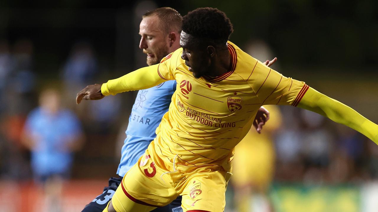 Al Hassan Toure, playing for United, up against Rhyan Grant of Sydney FC earlier this year.