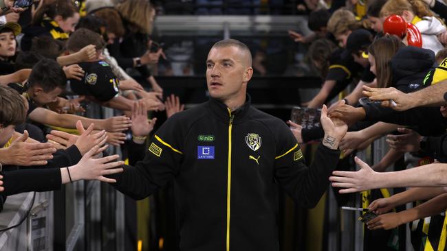 MELBOURNE, AUSTRALIA - AUGUST 24:  Dustin Martin of the Tigers acknowledges the fans after the round 24 AFL match between Richmond Tigers and Gold Coast Suns at Melbourne Cricket Ground, on August 24, 2024, in Melbourne, Australia. (Photo by Darrian Traynor/Getty Images)