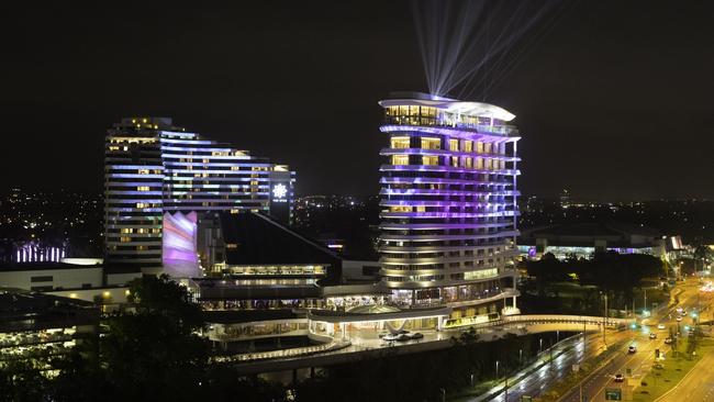 The Star Gold Coast's original Star Grand hotel (left) and The Darling all lit up in Broadbeach -a Singaporean high roller dropped $43m playing baccarat at the site in five days — and is refusing to pay citing dealer “mistakes” and a Star executive apologising for the mistakes.