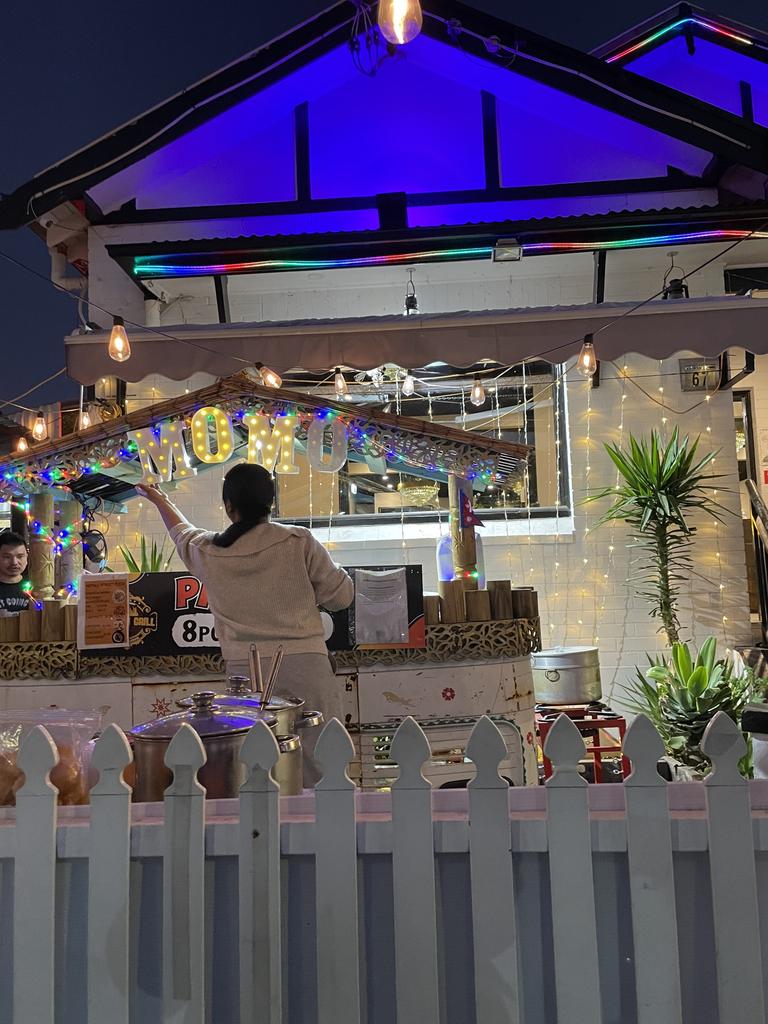 A Wigram St mobile vendor prepares for the night crowd as the sun goes down.