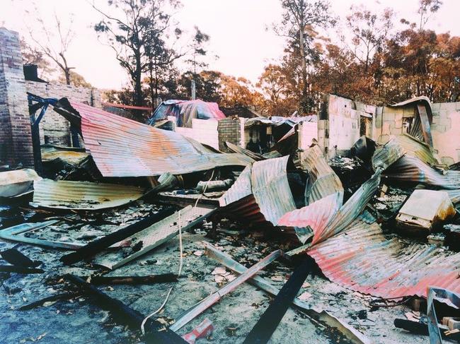 Rosemary Laing, swanfires, John and Kathy’s auto services, 2002-04, C Type photograph, 105 x 171cm. Courtesy of the artist and Tolarno Galleries, Melbourne.