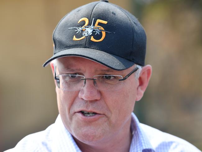 Prime Minister Scott Morrison is seen visiting a fire damaged property on Stokes Bay on Kangaroo Island, southwest of Adelaide, Wednesday, January 8, 2020. Prime Minister Scott Morrison is visting Kangaroo Island following the devastating bush fires which have burnt a third of the island. (AAP Image/David Mariuz) NO ARCHIVING