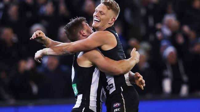 Taylor Adams celebrates with Adam Treloar after the siren. Picture: Phil Hillyard