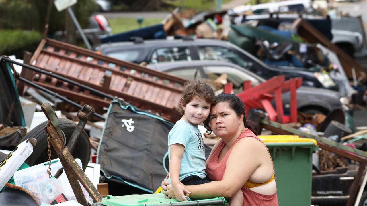 Sammara Gerrey with her 4-year-old daughter Amelia pictured on Diadem St in Lismore in the aftermath of the floods. Photo: Jason O'Brien