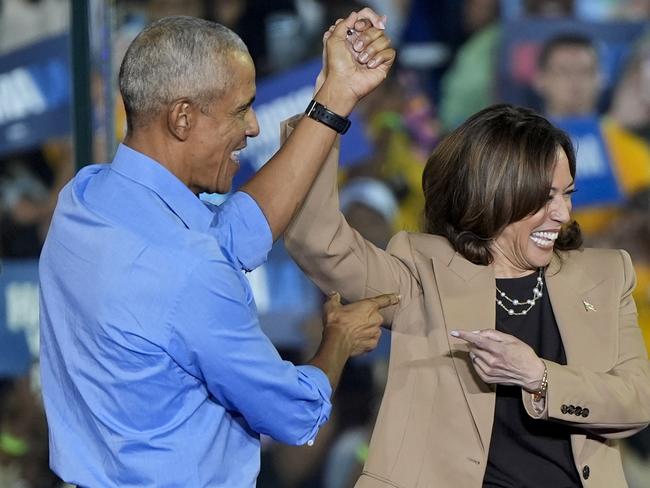 Former President Barack Obama gestures to Democratic presidential nominee Vice President Kamala Harris after introducing her to speak during a campaign rally for Harris on Thursday, Oct. 24, 2024, in Clarkston, Ga. (AP Photo/Mike Stewart)