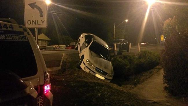 No one was injured when a car took a wrong turn off Ballina Rd at Lismore Heights on Wednesday and ended up perched precariously on an almost vertical slope. Photo: Rodney Stevens. Picture: Photo: Rodney Stevens