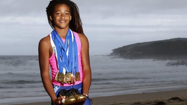 Malikye with just some of his huge collection of sporting medals. Picture: John Appleyard