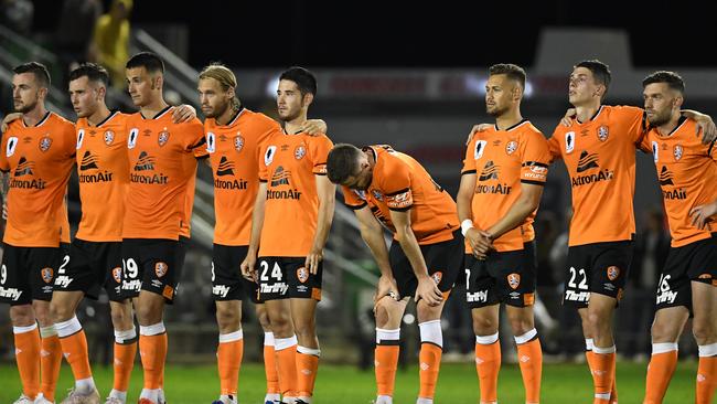 Roar players lookon during the penalty shootout against the Mariners. Picture: AAP