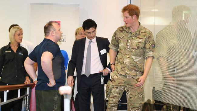 The work of Munjed Al Muderis, centre, with soldiers attracted the attention of Prince Harry, who visited his clinic at Macquarie University.