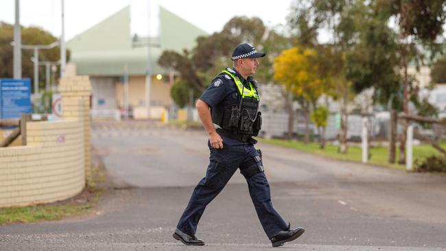 Police and media watch on as George Pell leaves Barwon Prison in Anakie, Victoria, after the High Court quashed his conviction. Picture: Mark Stewart