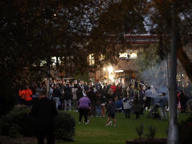 More than 200 people gathered at the local park for the solemn vigil. Picture: Jonathan Ng