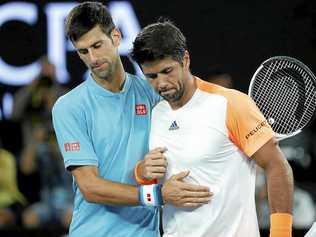 Novak Djokovic (left) of Serbia thanks Fernando Verdasco of Spain after their first-round match at the Australian Open. Picture: MADE NAGI